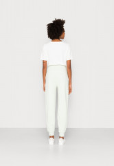 Tommy Hilfiger Tracksuit bottoms accent green Нижняя часть спортивного костюма зеленый акцент