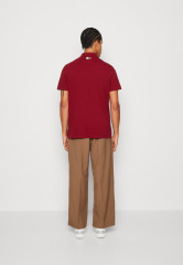 Tommy Hilfiger TOMMY HILFIGER X SHAWN MENDES POLO UNISEX Polo shirt rouge TOMMY HILFIGER X SHAWN MENDES POLO UNISEX Рубашка поло румяна